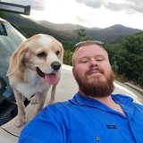 Nick, founder of Caravan Compare, with his dog Evee